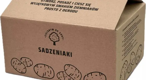 Pudełko z ziemniakami sadzeniakami. Napis "Otwórz, posadź i ciesz się wyjątkowym smakiem ziemniaków prosto z ogrodu". Z pewnością ziemniaki Corinna opinie będą pozytywne!